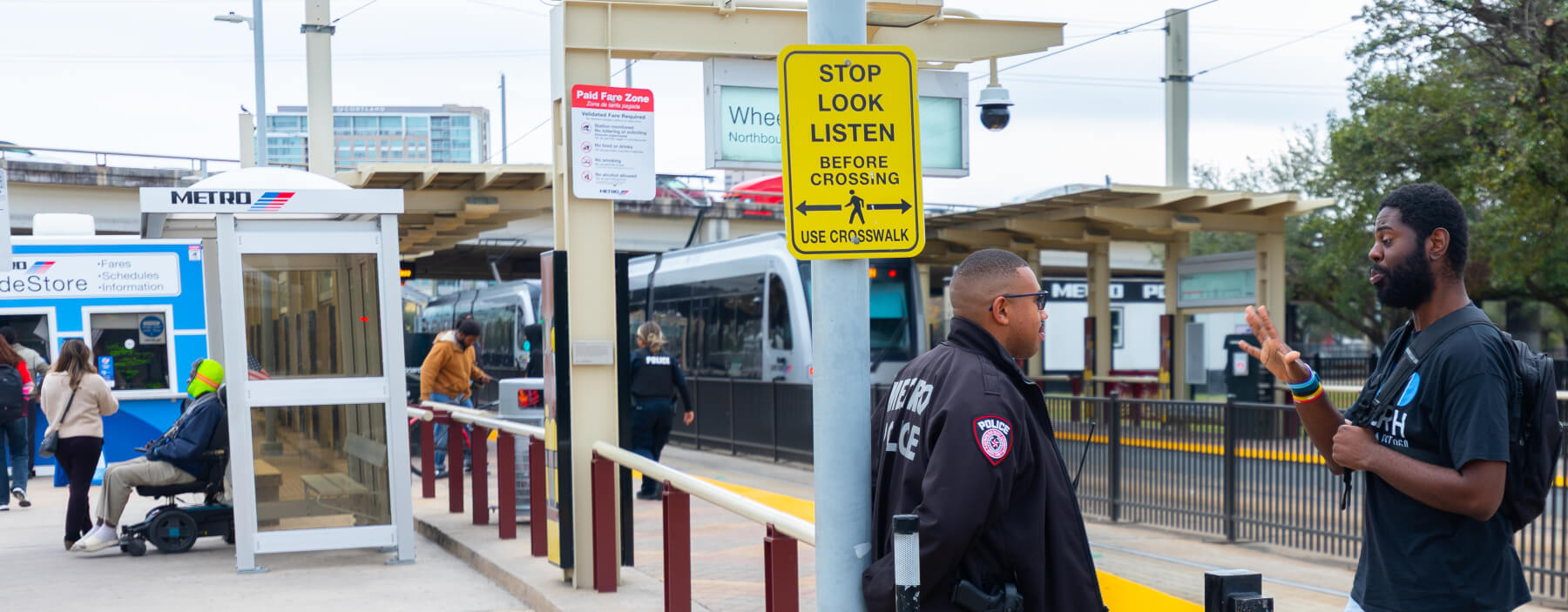 METRO Police Officer speaking with a customer at Wheeler Station.