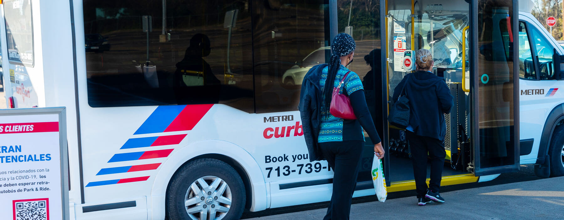 Riders boarding a METRO curb2curb shuttle.