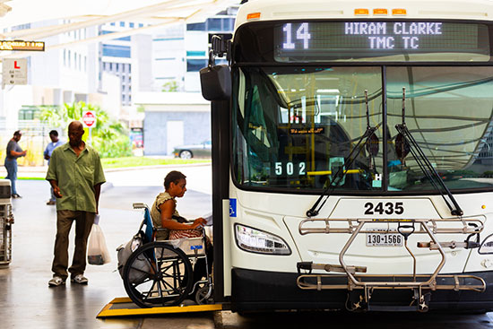 12823-accessibility-550x367 Wheelchair Rider boarding accessible METRO local bus at a METRO transit center.