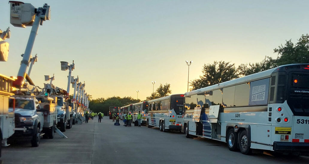 Utility trucks METRO buses lined up.