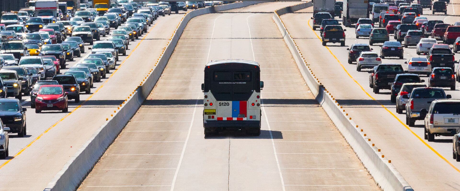 METRO Park & Ride bus traveling in HOV lane on U.S. Highway 59 South with gridlock traffic in both directions.