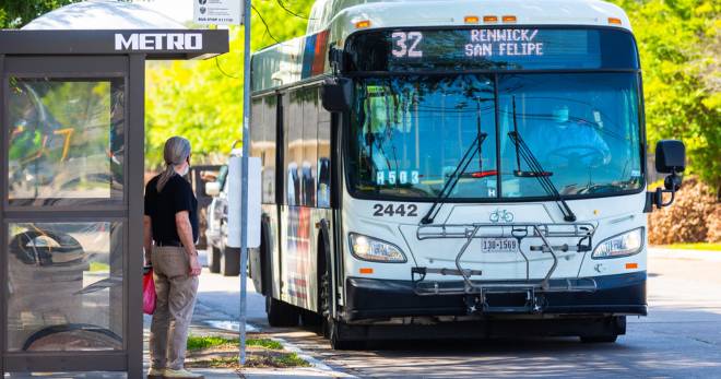 Photo of a man about to board a METRO bus.