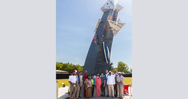 Officials take photo in front of the Tower