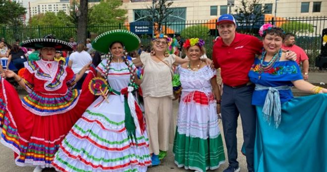 Ballet Folklorico dancers take a moment to snap a photo with METRO Sr. Public Engagement Representative Luis Garcia at LULAC’s Cinco de Mayo Parade.