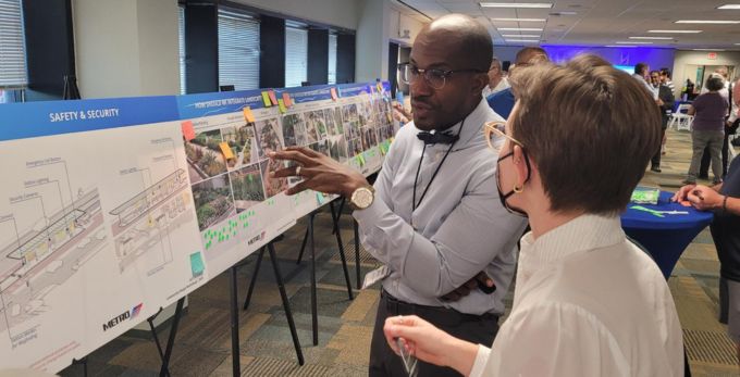METRO planner engages with a local community member on University Corridor facts.