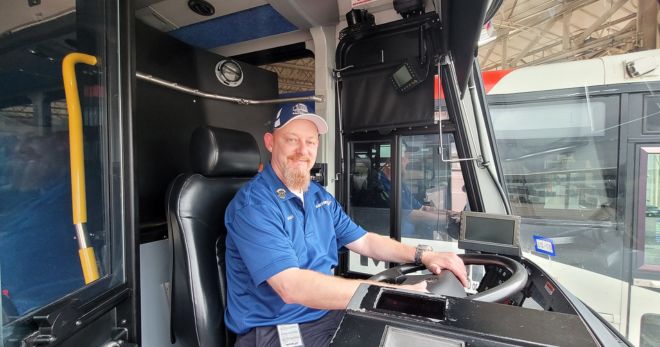 Photo of Bus Operator Gary Williams behind the wheel.