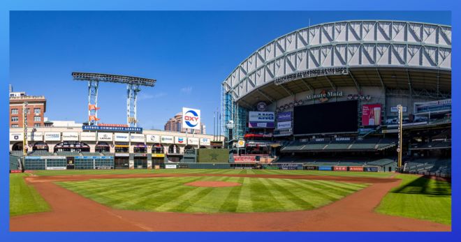 Wideshot of Minute Maid Park with roof open on a clear sunny day.