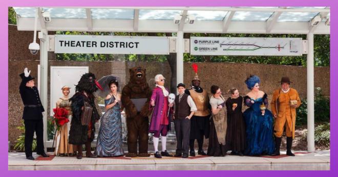 Theater District performers stand in costume at Theater District Station.