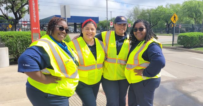 Four female METRO employees in safety vests.