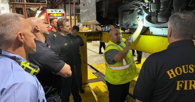 METRO Instructors show new firefighters how to access a train panel.