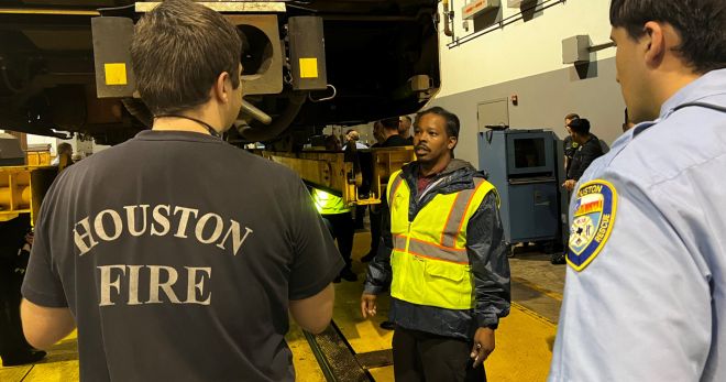 METRO instructor teaches firefighters how to access train during an emergency.