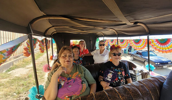 A group of riders on the small bus tour for the festivities on Dia de los Muertos, in Magnolia Park.