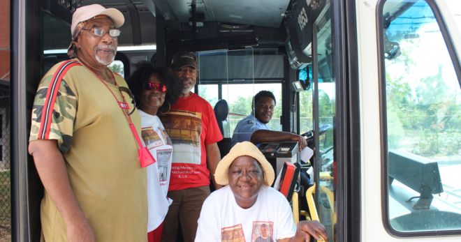 Family members take a photo on a METRO bus in Houston's Fifth Ward neighborhood.