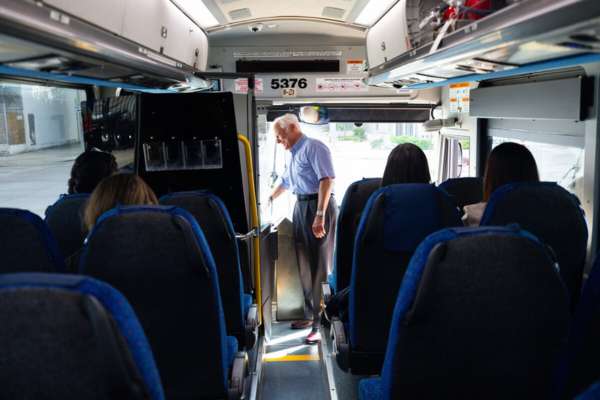 METRO Board Member Mayor Bob Fry greets an operator as he boards the bus.
