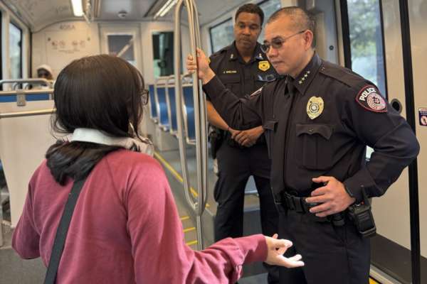 METRO Police Chief Ban Tien talks to a passenger on the METRORail.