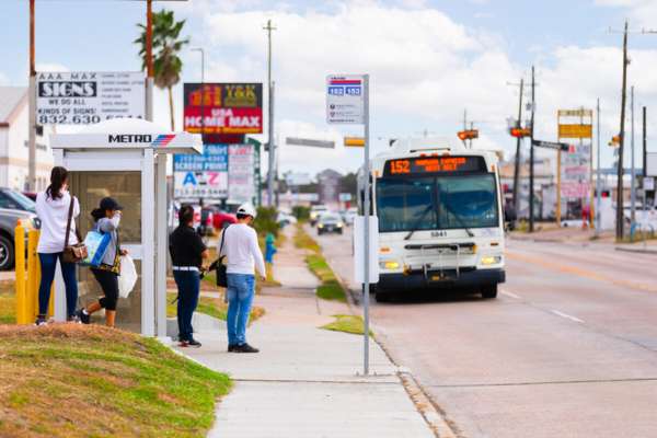 Riders are waiting to board the 152 Harwin Express.