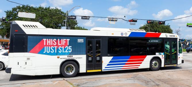 METRO 82 Westheimer bus riding along a surface street,