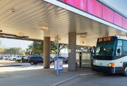 6417-Access-By-Car-429X292 Cars parked in lot adjacent to METRO Park & Ride bus.
