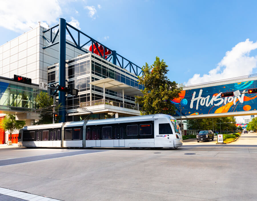 METRORail train passing in front of George R. Brown Convention Center.