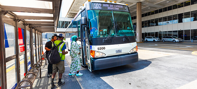 Riders boarding the 102 IAH Express Local Bus at George Bush Intercontinental Airport