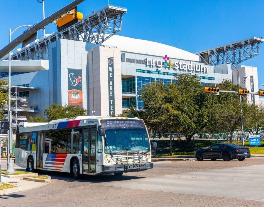 METRO local bus driving past NRG Stadium.