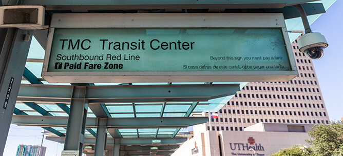 METRORail Red Line signage at the TMC Transit Center station.