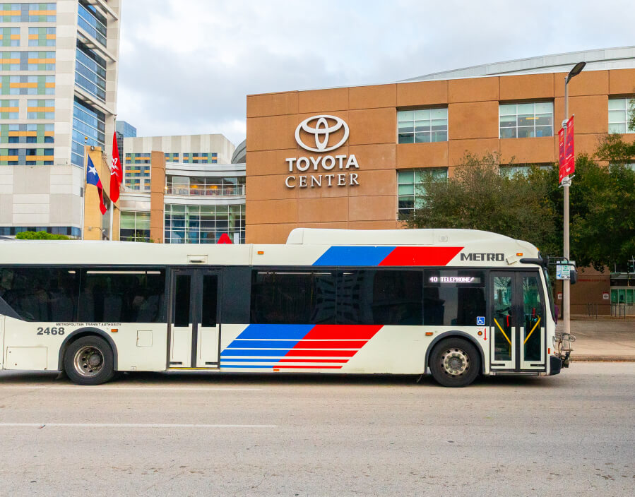A local bus traveling near Toyota Center in Downtown Houston.