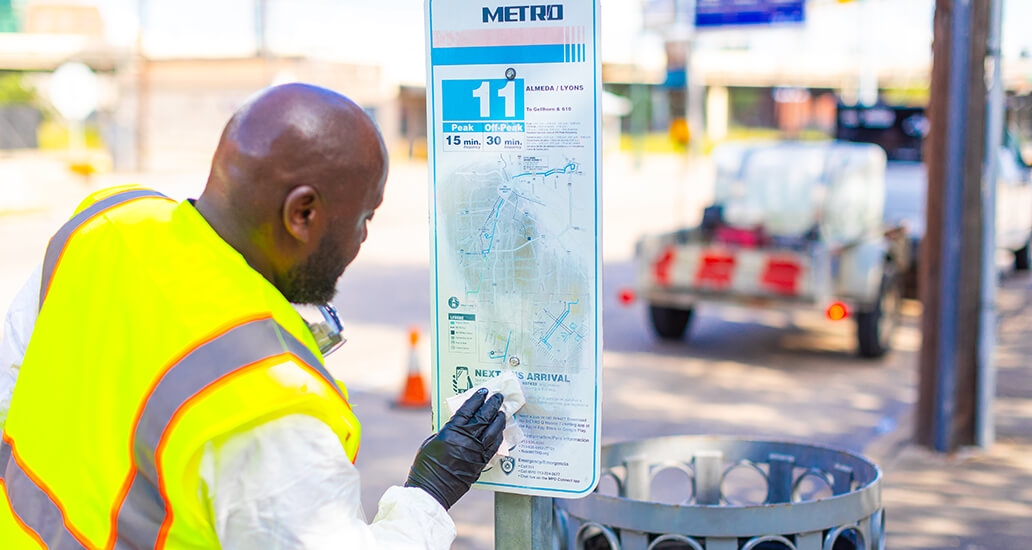 METRO wayfinding signage being cleaned.