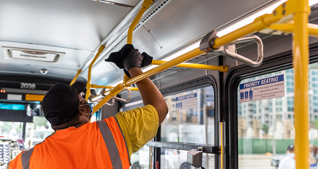 The handlebars inside of a METRO local bus being wiped down and sanitized.