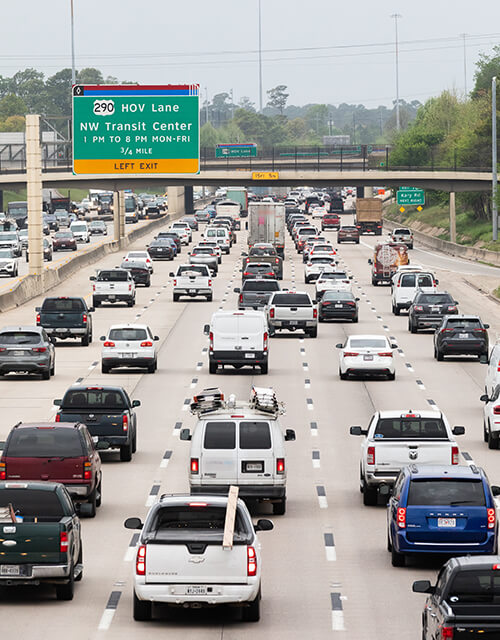 Vehicles traveling in traffic on Interstate 10 in Houston Texas.