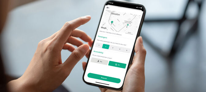 Person using Ride Circuit app on a smartphone.