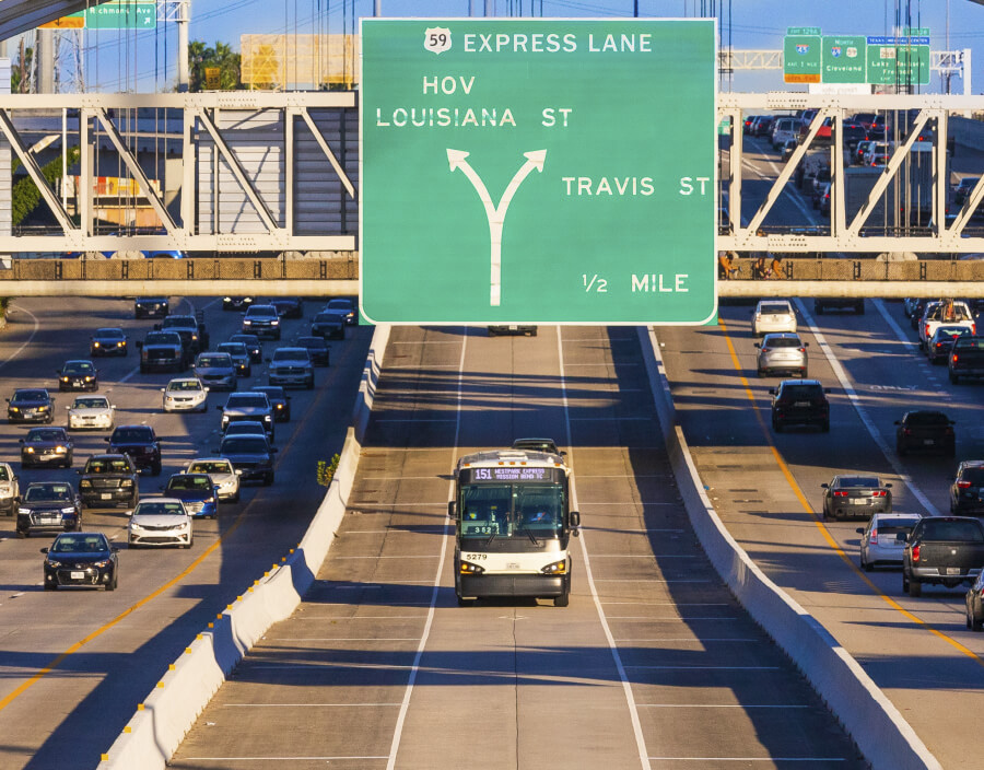 A METRO local bus on the 151 Westpark Express traveling in the Interstate 59 HOV/HOT Express Lane.