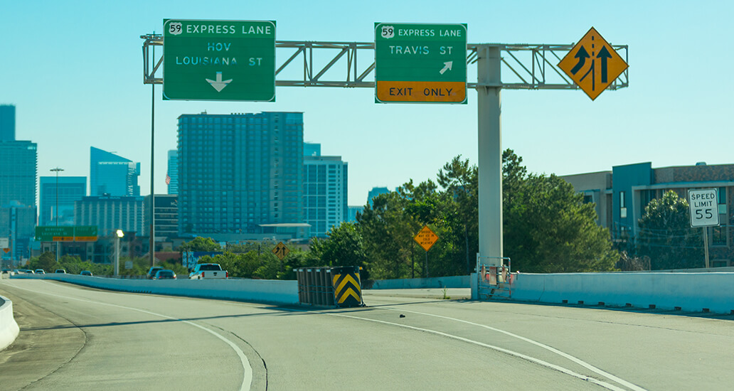 US Highway 59 Express Lane exit sign toward Travis Street