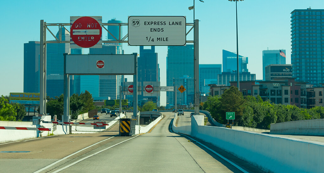 US Highway 59 Express Lane exit sign toward Brazos and Louisiana Streets