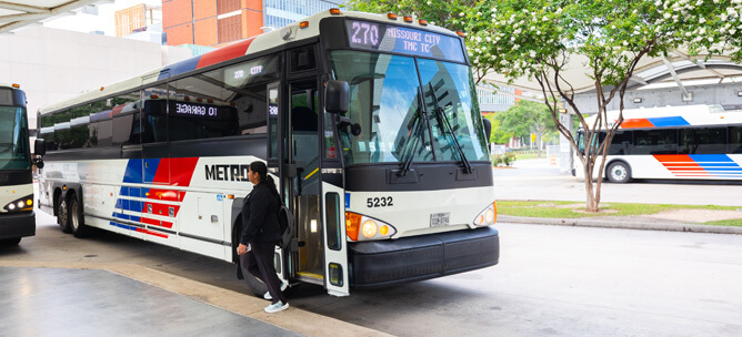 Rider getting off the Park & Ride bus at the TMC Transit Center in Houston, Texas.
