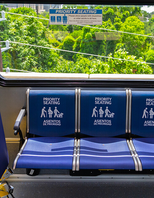 Priority seating onboard a METRO bus for people with disabilities and older adults.