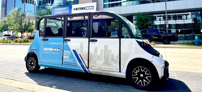 A Community Connector shuttle traveling near the Downtown Transit Center in downtown Houston.